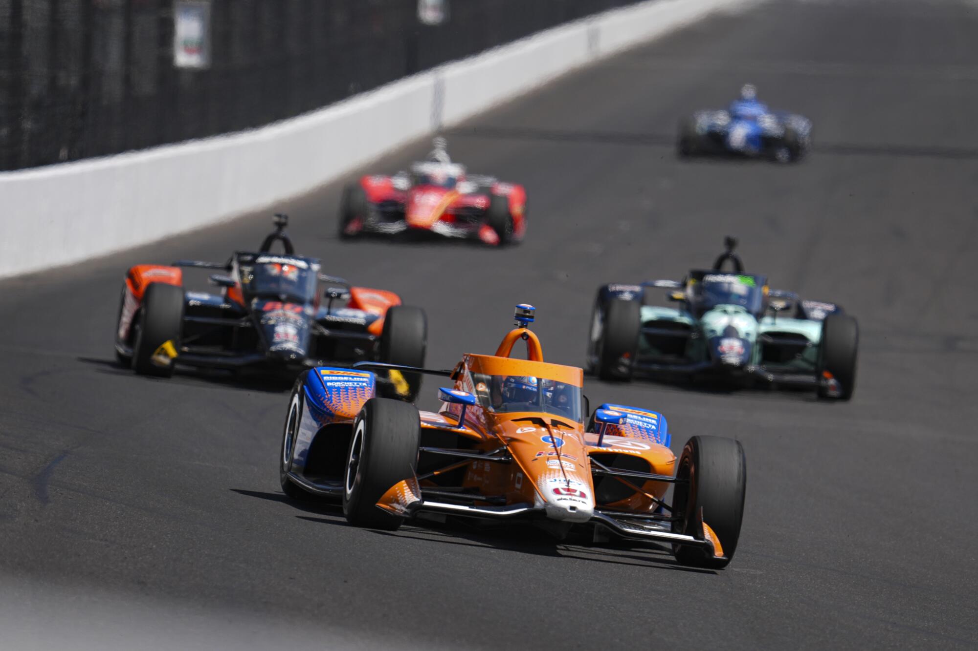 Scott Dixon drives into the first turn during practice for the Indianapolis 500 on Friday.