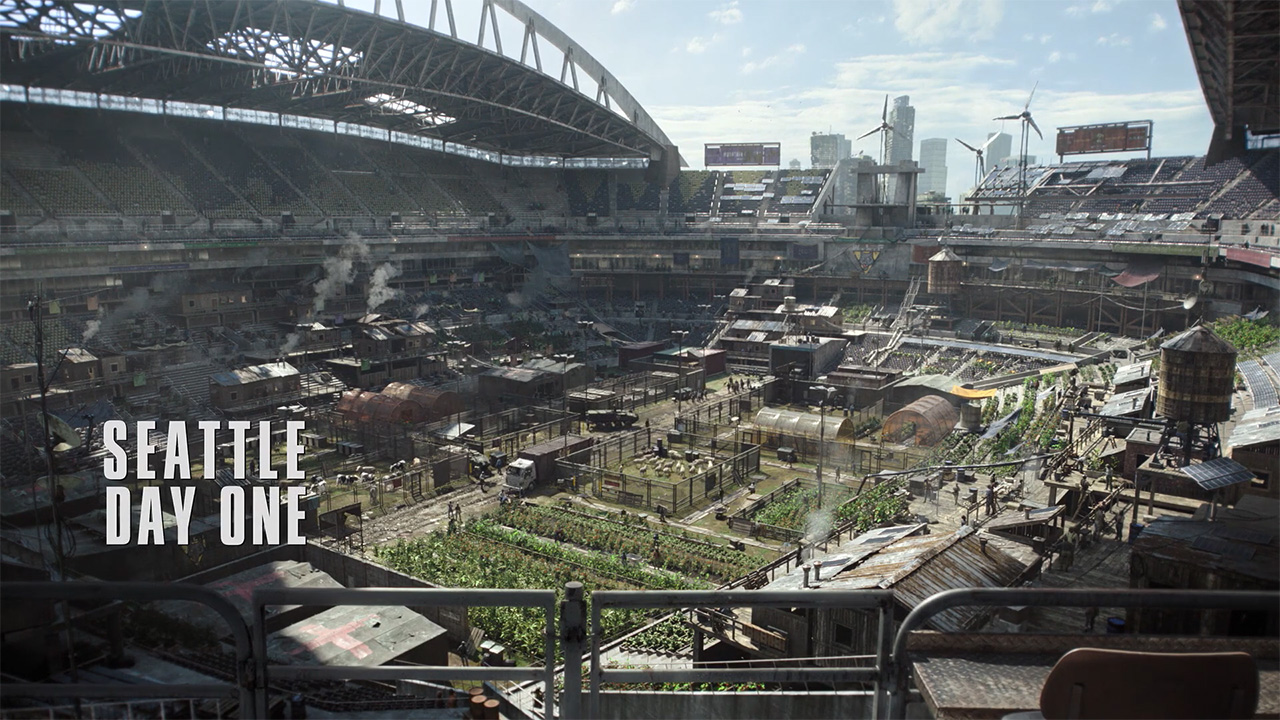 A screenshot of a US football stadium with the words 'Seattle Day One' burned on top of it in The Last of Us season 2 episode 7