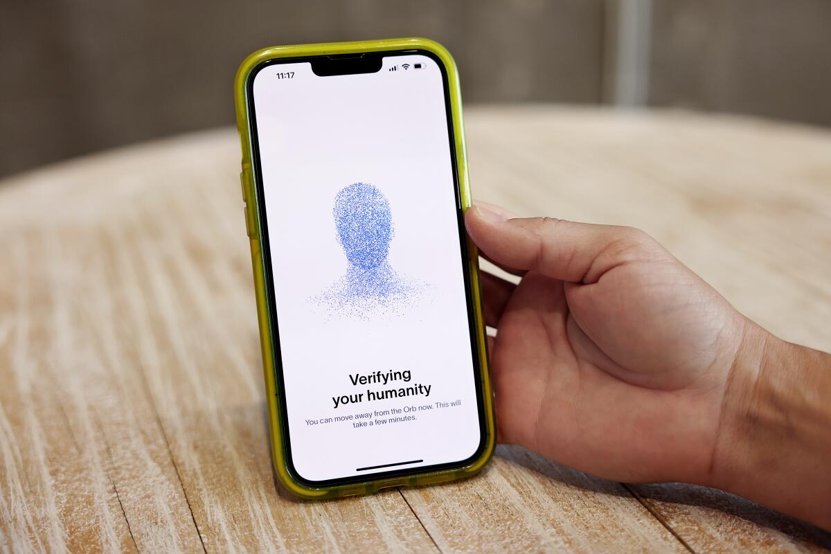 Frankie Reina waits to be verified after getting an eye scan.