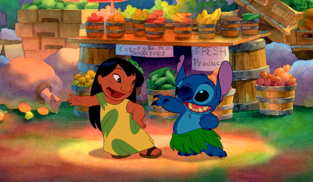Lilo and Stitch dance in a still from the 2002 animated film.