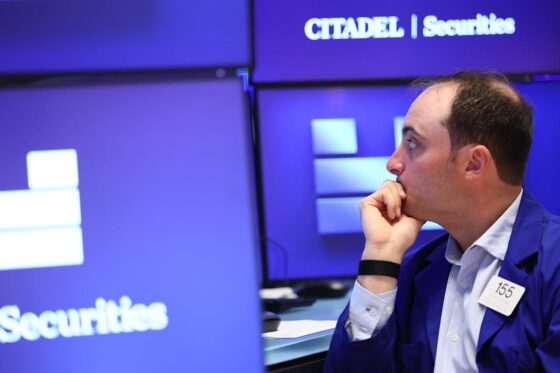 Dow jumps, Nasdaq slides as Trump tax bill sails through Senate