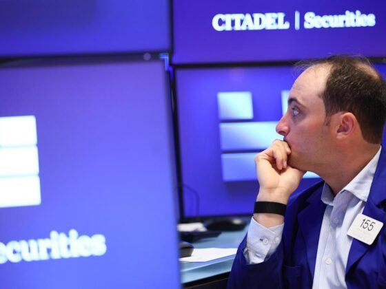 Dow jumps, Nasdaq slides as Trump tax bill sails through Senate