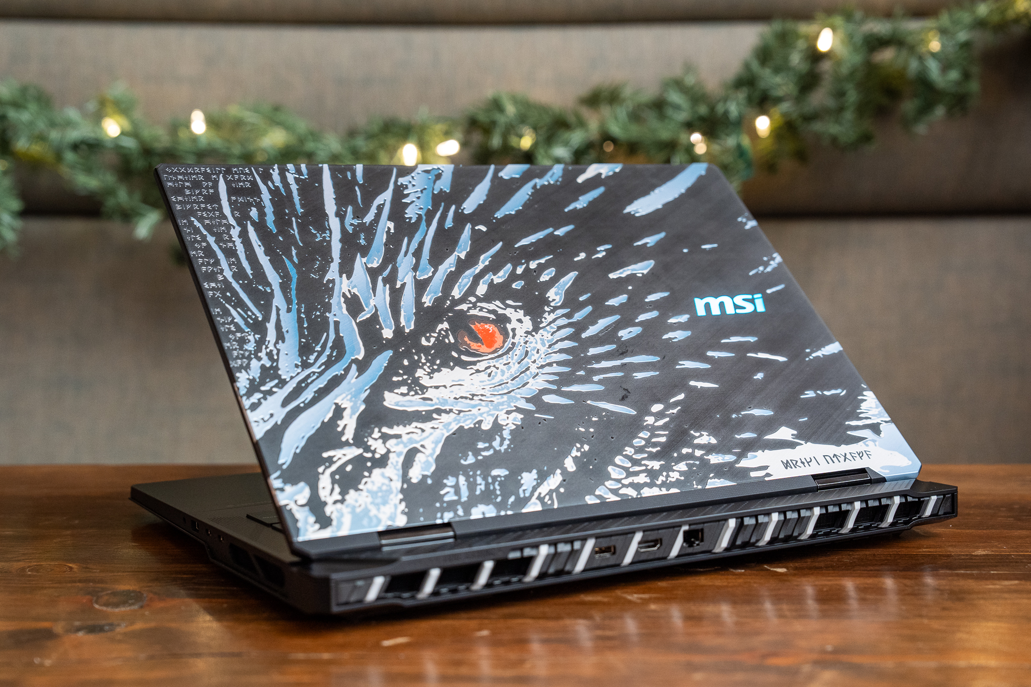 The rear view of the MSI Titan 18 HX Dragon Edition, with a hand-drawn dragon design on its lid.
