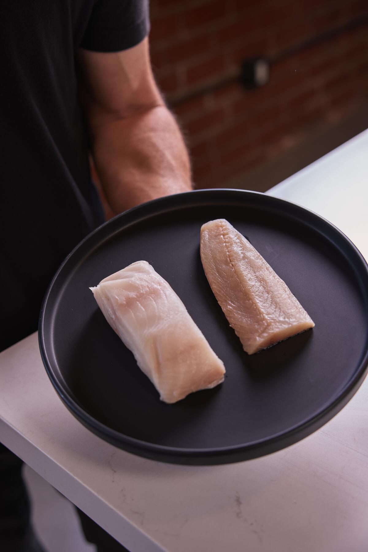 A regular fish fillet, left, is next to an ikejime filet that was processed by a Poseidon.