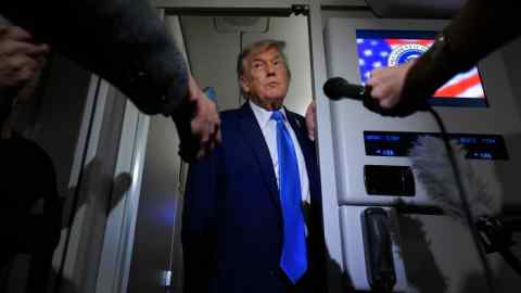 President Donald Trump talks to reporters on board Air Force One after leaving the G7 leaders’ summit in Canada earlier this month