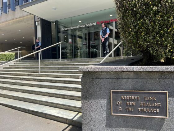 New Zealand keeps interest rates on hold but flags likely cut