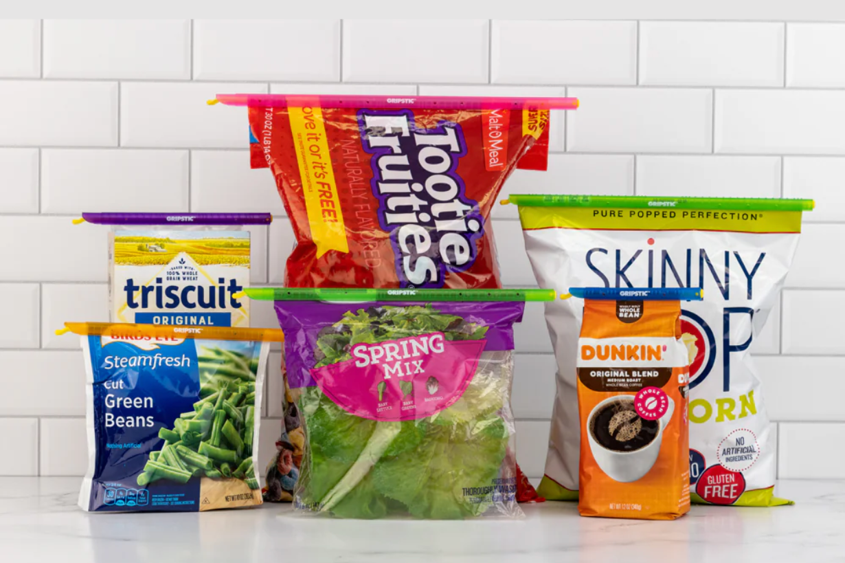 Four bags sealed at the top with long plastic strips.