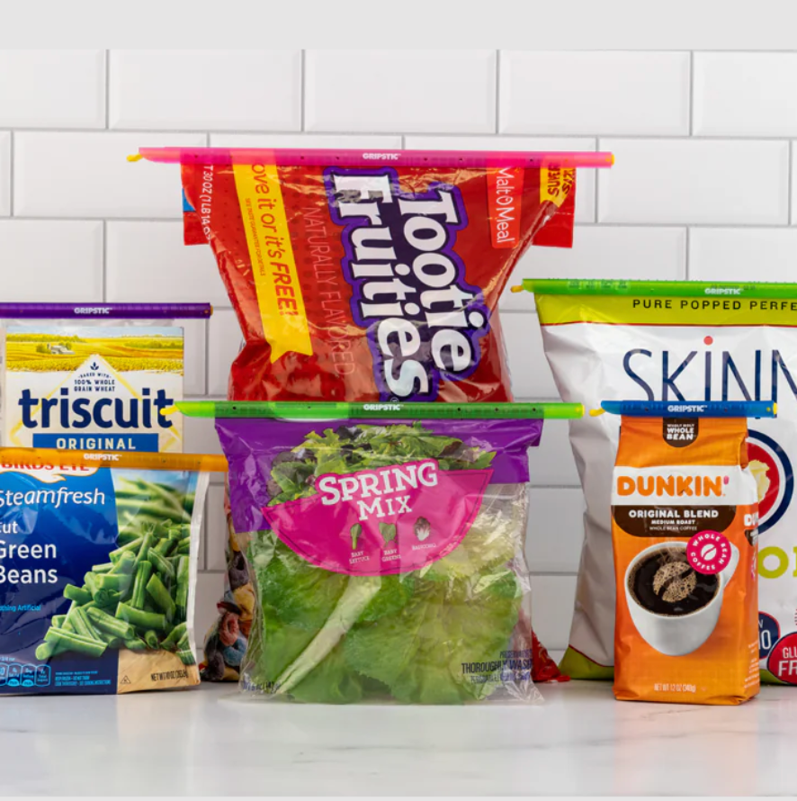 Four bags sealed at the top with long plastic strips.