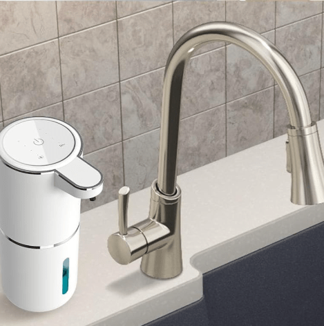 Soap dispenser next to faucet.