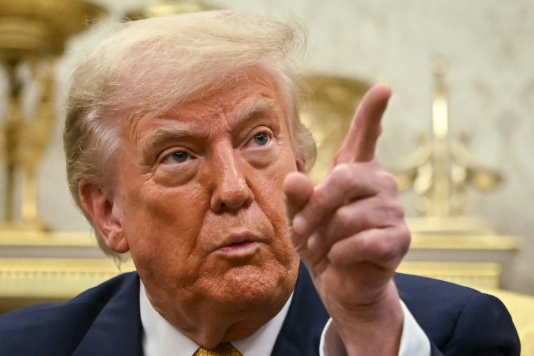 Trump says not firing Fed chair -- but not ruling out