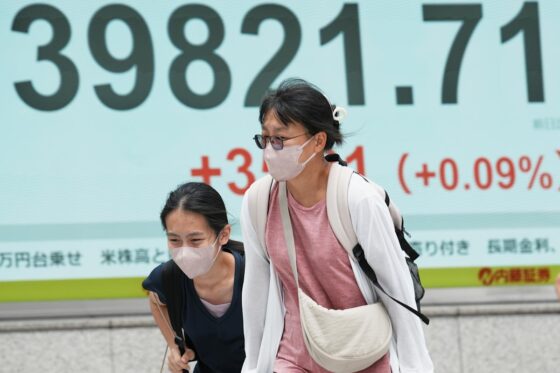 World shares are mostly down as Trump’s tariff deadline looms, while US stocks set records