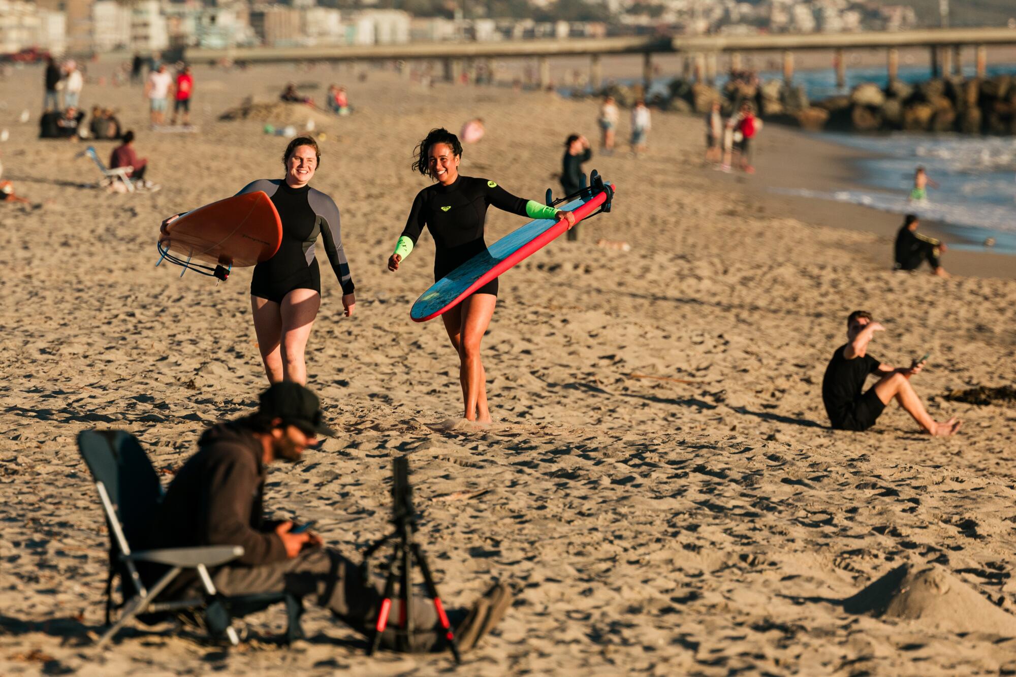 People enjoy a day at Venice Beach in April 2024.