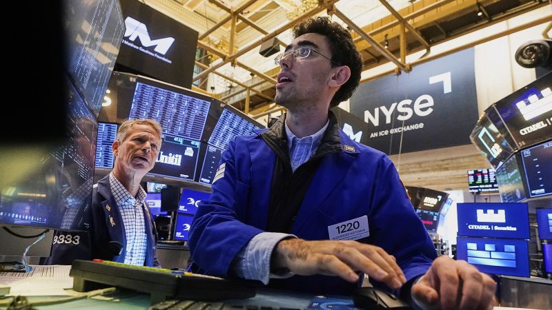 Dow soars 800 points and hits record high as Powell hints at rate cut