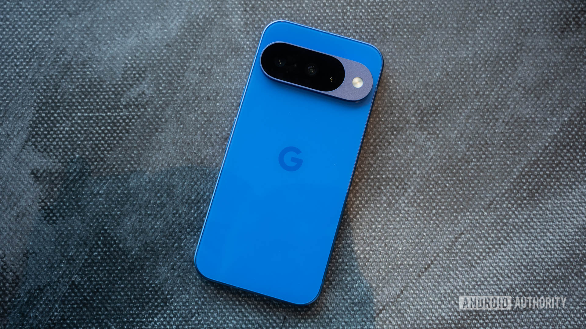 Google Pixel 10 in Indigo flat on table Google Pixel 10 in Indigo flat on table
