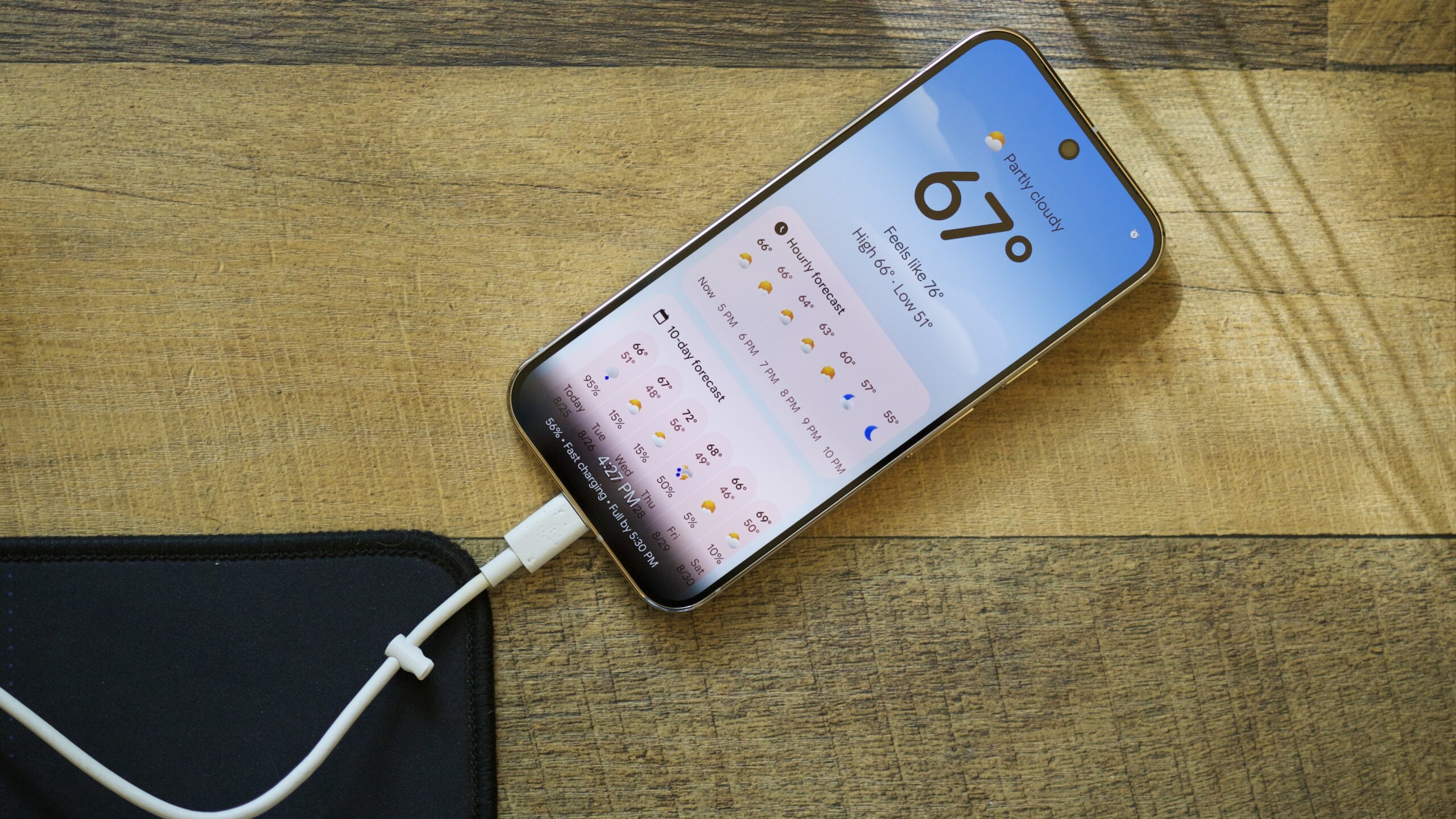 Screen Saver feature running on a Google Pixel 10 Pro while plugged into a wired charger.