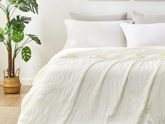 Amazon is selling a 'buttery-soft' 9 reversible cooling queen comforter that feels 'light and airy' for only 