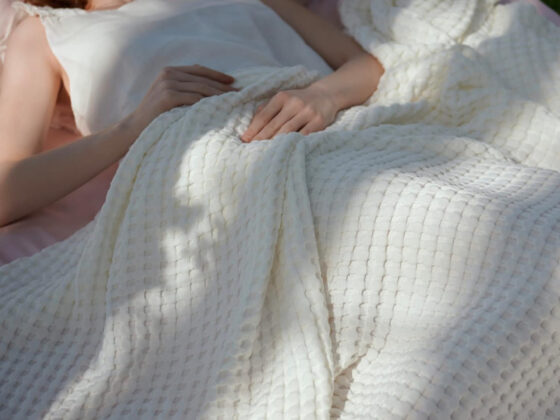 Amazon is selling a cooling queen bed blanket for only  that hot sleepers say is 'the perfect weight'
