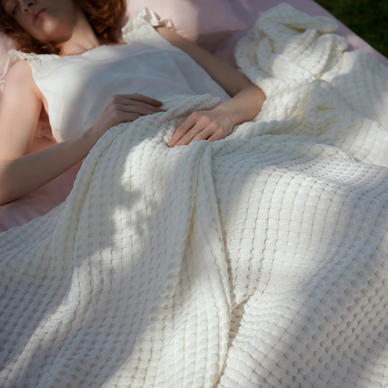 Amazon is selling a cooling queen bed blanket for only $36 that hot sleepers say is 'the perfect weight'