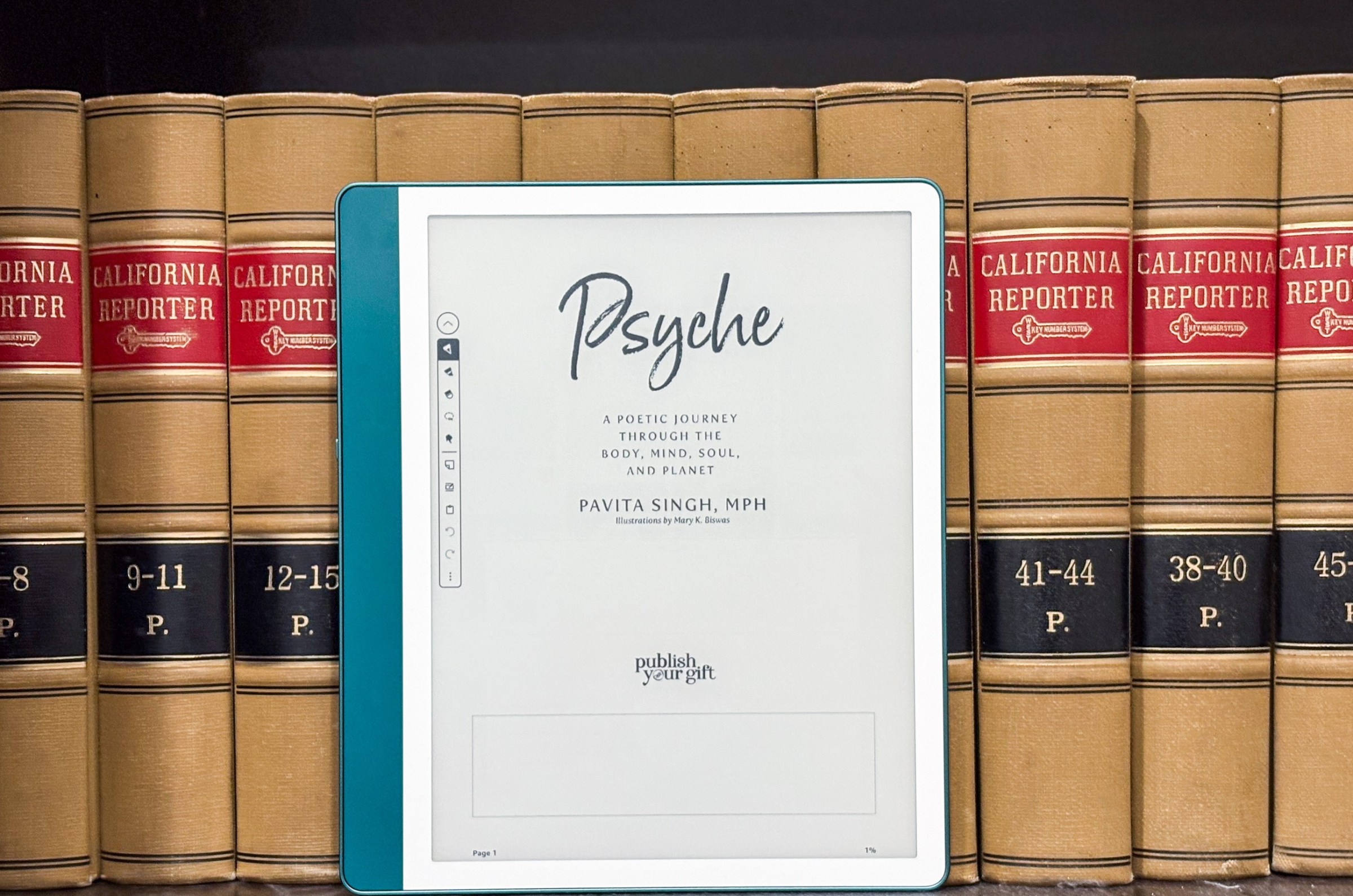 The Kindle Scribe in front of a bunch of books sitting on a shelf.