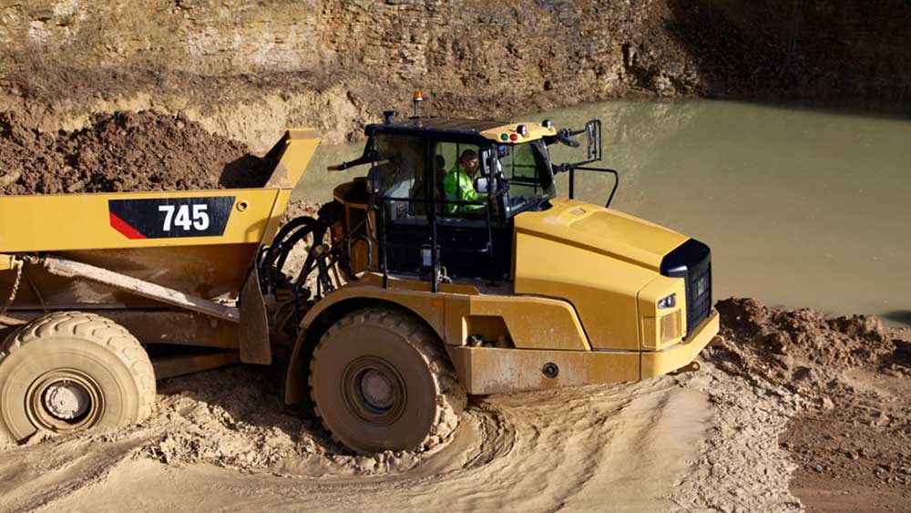 Caterpillar Warns Of Bigger Hit From Trump Tariffs; CAT Stock Dings Dow Jones