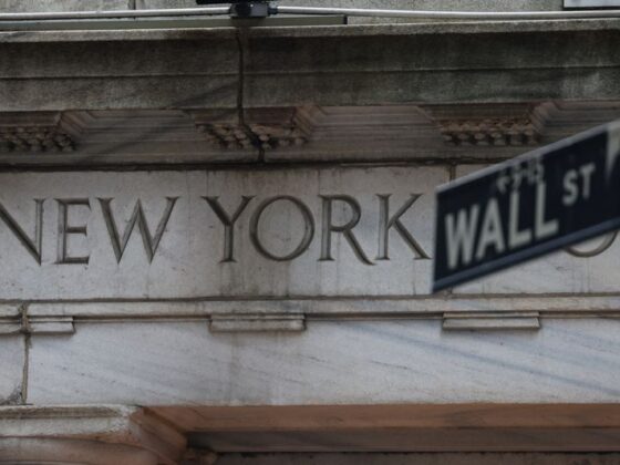 Wall St futures steady, chip stocks slip on China sales deal