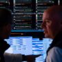 Wall Street closes out a wild month on a subdued note
