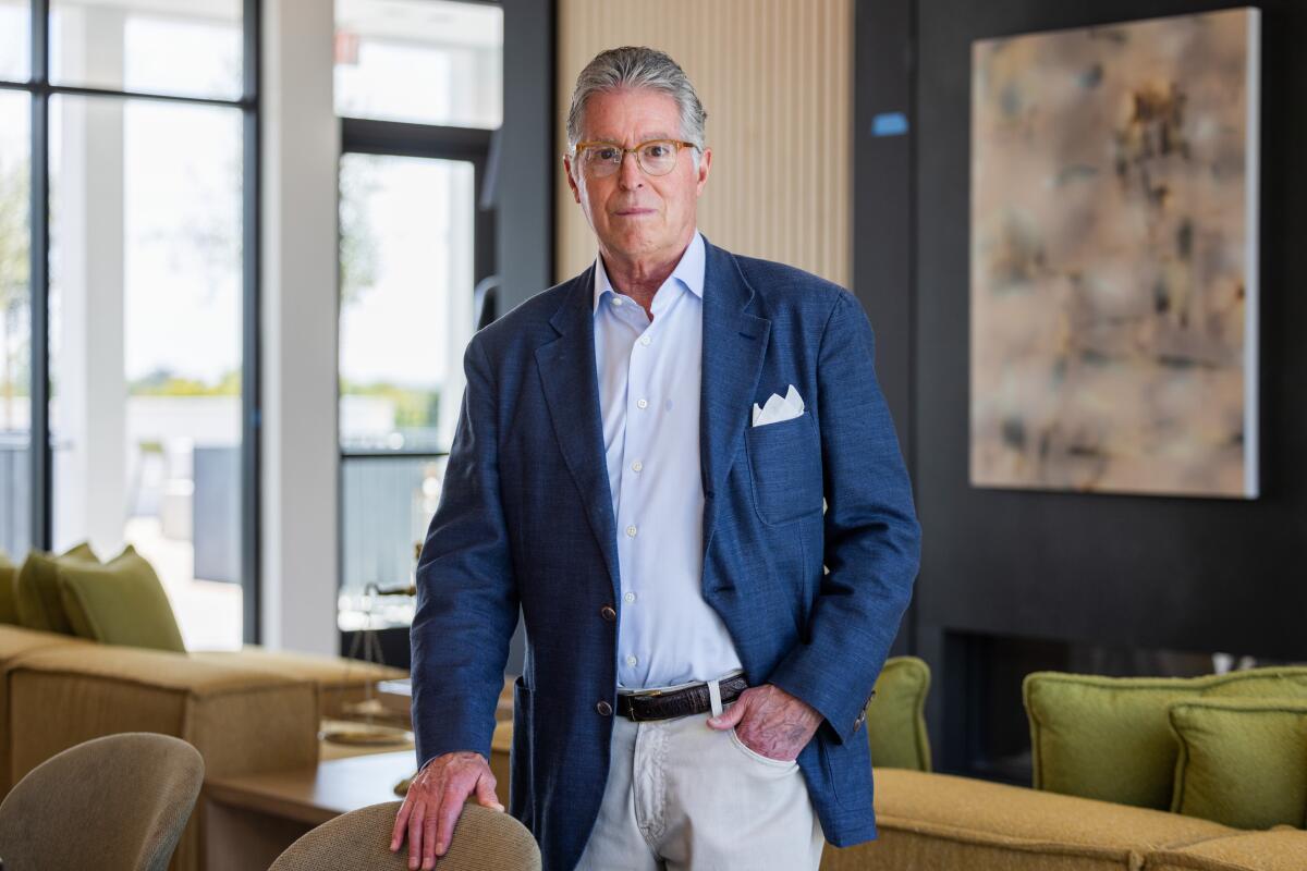 Developer Lee Wagman of GPI Companies stands in the rooftop lounge.