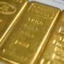 Gold hits new high on rising uncertainty, while U.S. stock futures little changed
